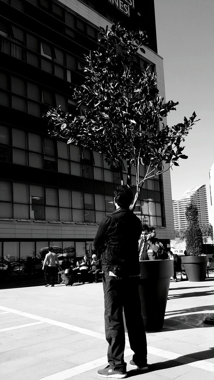 SILHOUETTE OF WOMAN IN CITY