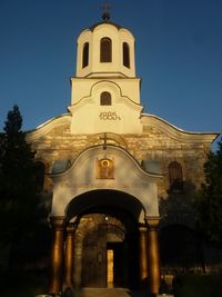 Low angle view of bell tower against sky