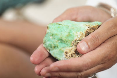 Close-up of woman holding quartz