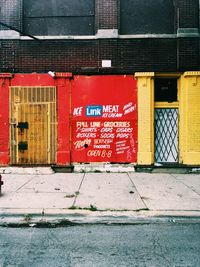 Text on red building by road