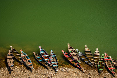 High angle view of boats moored on shore