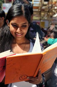 Young woman reading book