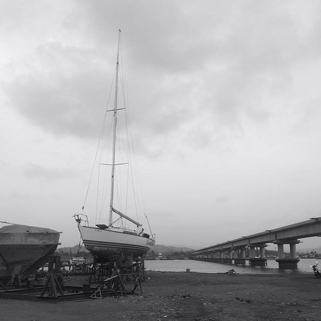 sky, water, nautical vessel, sea, transportation, cloud - sky, boat, mode of transport, moored, cloudy, cloud, tranquility, nature, built structure, day, pier, tranquil scene, horizon over water, outdoors, harbor