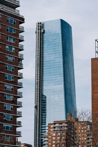 Low angle view of modern buildings against sky