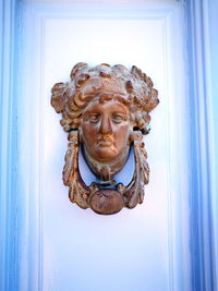 Close-up of statue against door