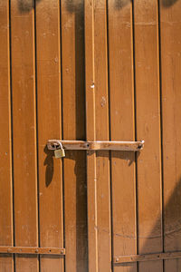 Full frame shot of closed brown wooden door