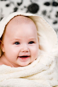 Portrait of little baby and the white towel