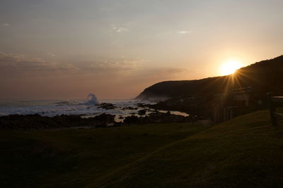 Scenic view of sunset over land