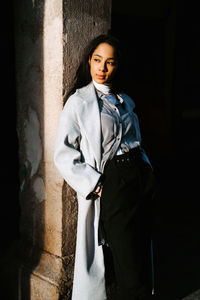 Portrait of a young woman standing outdoors