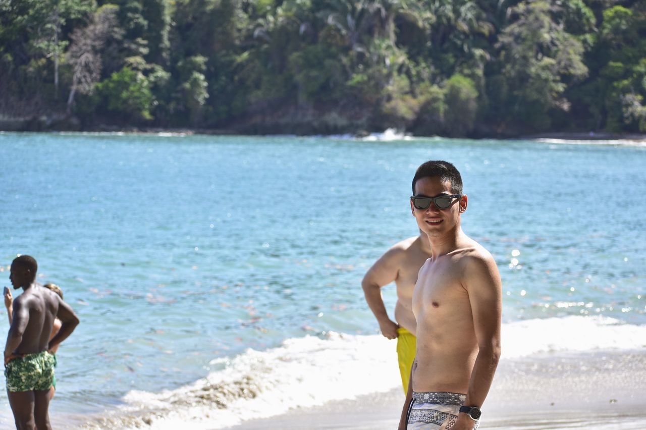 PORTRAIT OF SHIRTLESS MAN IN SEA