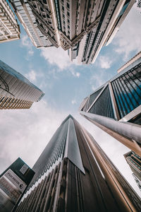 Low angle view of building against cloudy sky