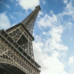 Low angle view of tower against cloudy sky