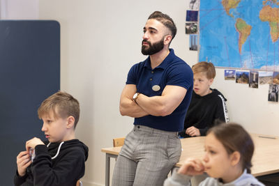 Teacher and schoolchildren in classroom
