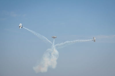 Low angle view of airplane flying in sky