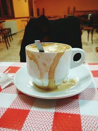 Close-up of coffee cup on table