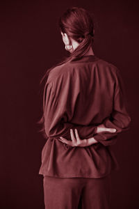 Rear view of woman wearing fashionable casuals