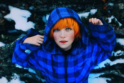 Portrait of woman wearing blue hood clothing