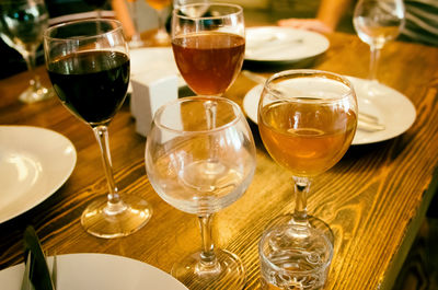 Close-up of wine glasses on table