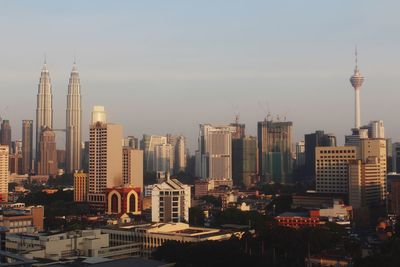 Modern buildings in city against sky