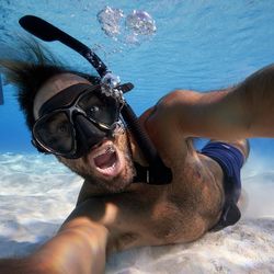 Portrait of man snorkeling in sea