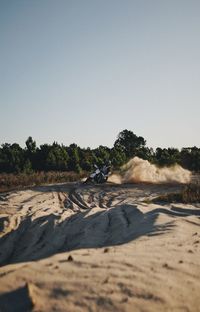 Scenic view of beach against clear sky