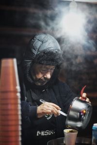 Portrait of man holding camera