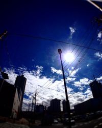 Low angle view of street light against sky