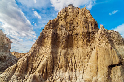 Low angle view of rock formation at tatacoa desert against sky