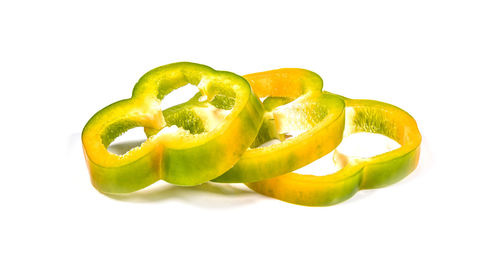 Close-up of bell peppers against white background