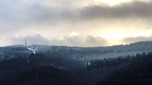 Scenic view of landscape against sky during winter