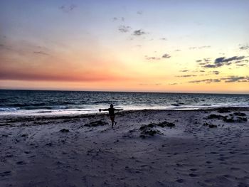 Scenic view of sea at sunset