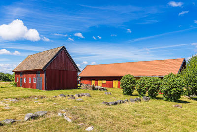 House on field against sky