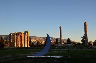 Sculpture of building against clear blue sky