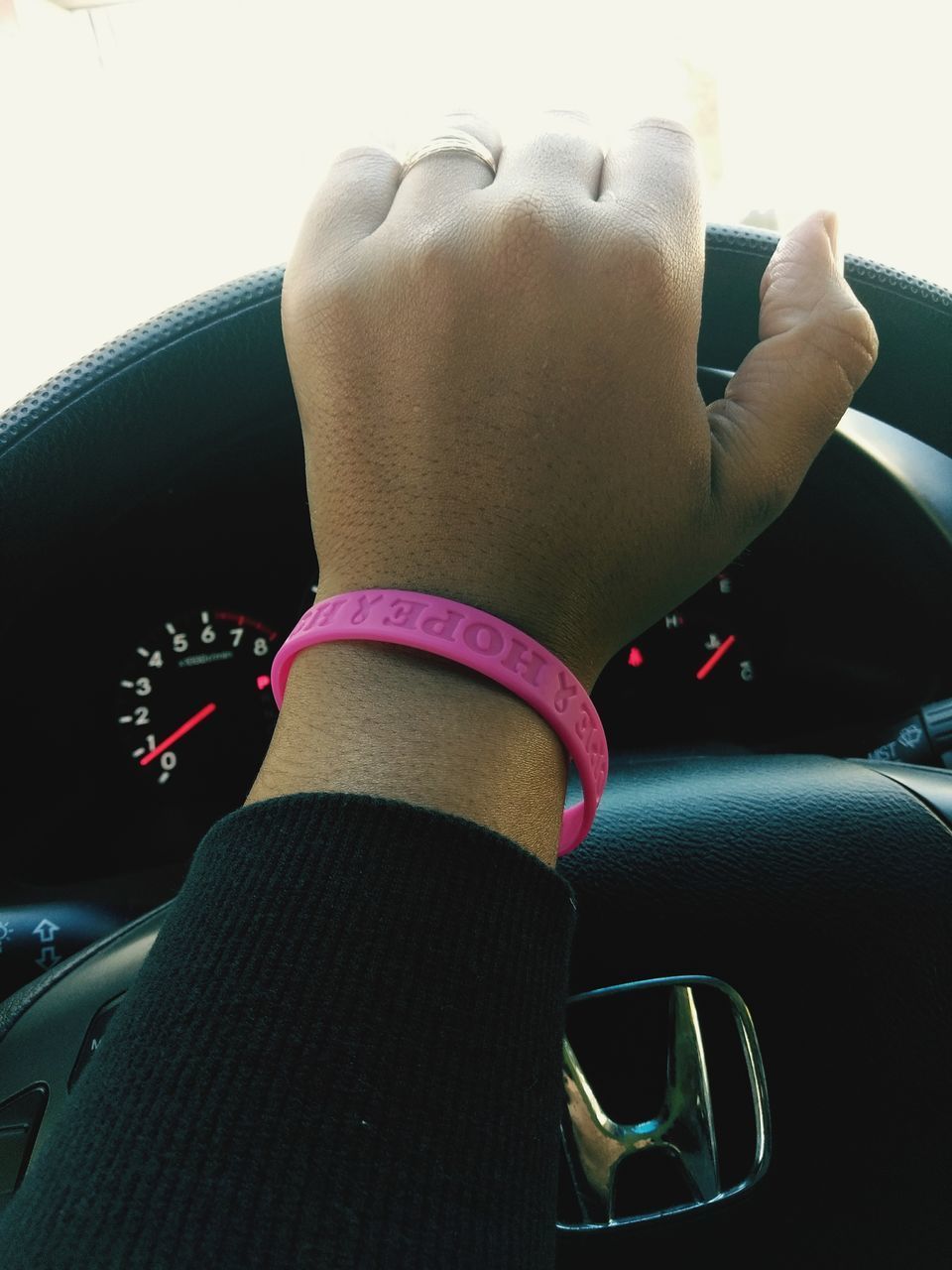 CLOSE-UP OF WOMAN HAND WITH CAR