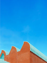 Low angle view of building against blue sky