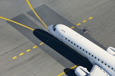 Aerial view of airport. airplane taxiing to runway before take off.