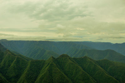 Scenic view of agricultural landscape against sky