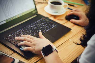 High angle view of man using laptop on table