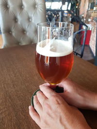 Close-up of man holding drink