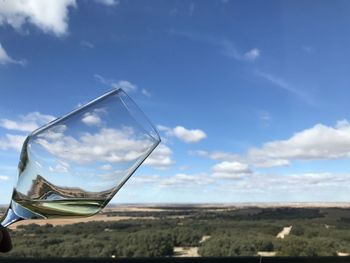 Low angle view of glass land against sky