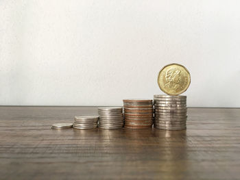 Stack of coins on table