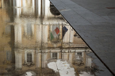 High angle view of building in puddle during rainy season