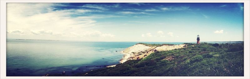 Scenic view of sea against cloudy sky