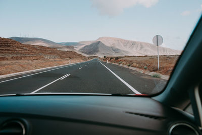 Road seen through car windshield