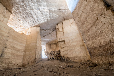 Sunlight falling on rock amidst buildings