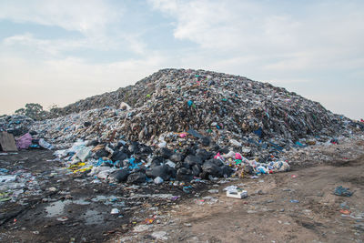 Garbage on street against sky