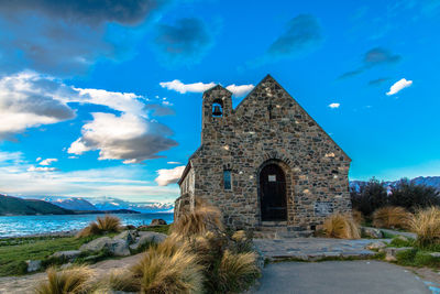 Low angle view of church against blue sky