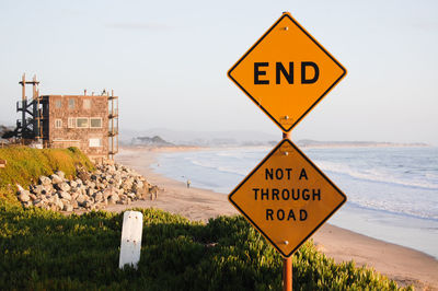 Warning sign on sea shore