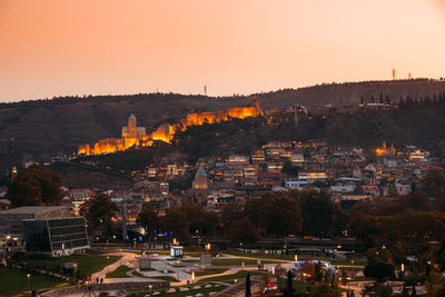 High angle view of city buildings during sunset