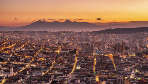 High angle view of city against sky during sunset